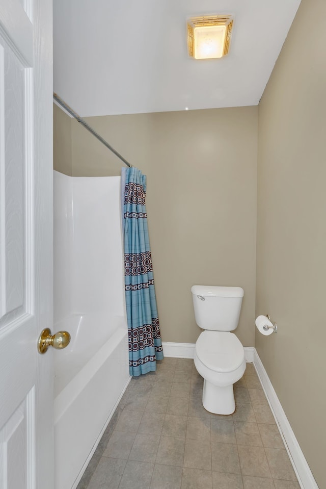 bathroom with shower / tub combo, toilet, and tile patterned floors