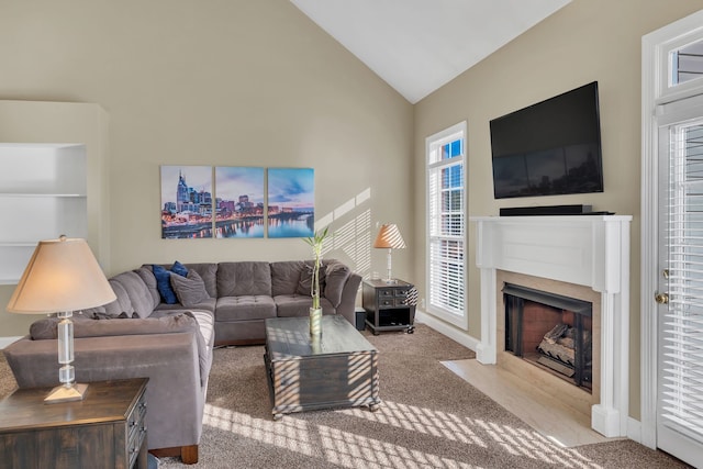 living room with carpet flooring and high vaulted ceiling