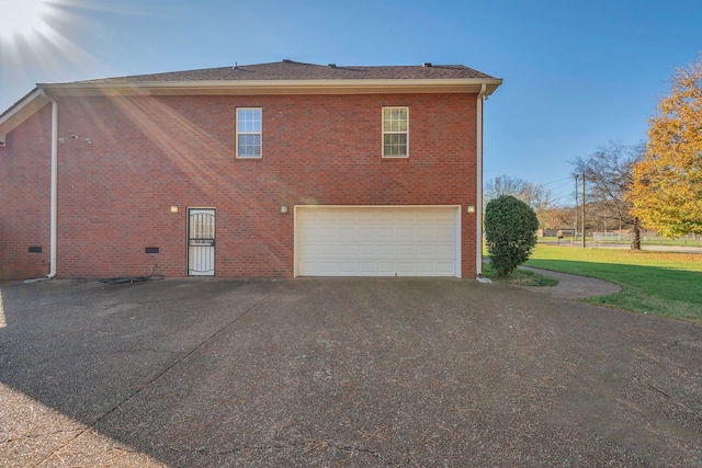 view of side of property with a garage