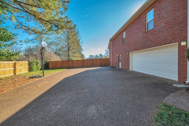 view of side of property with a garage