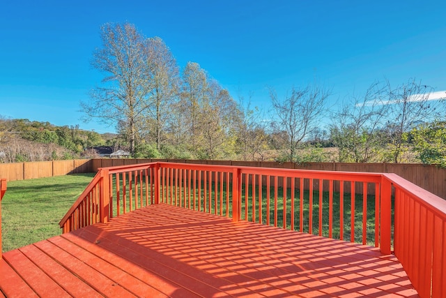 wooden deck featuring a yard