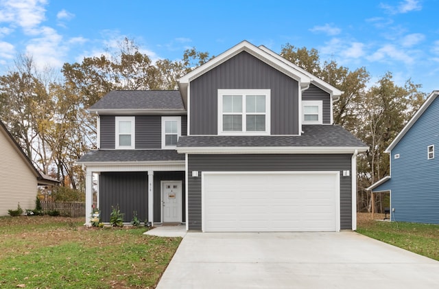 front facade with a front lawn and a garage