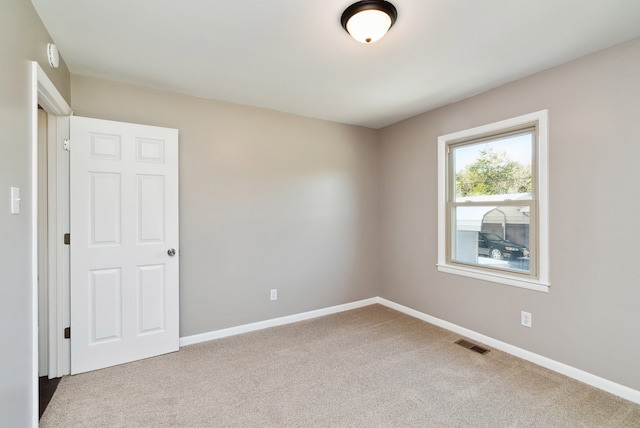 unfurnished room featuring carpet flooring