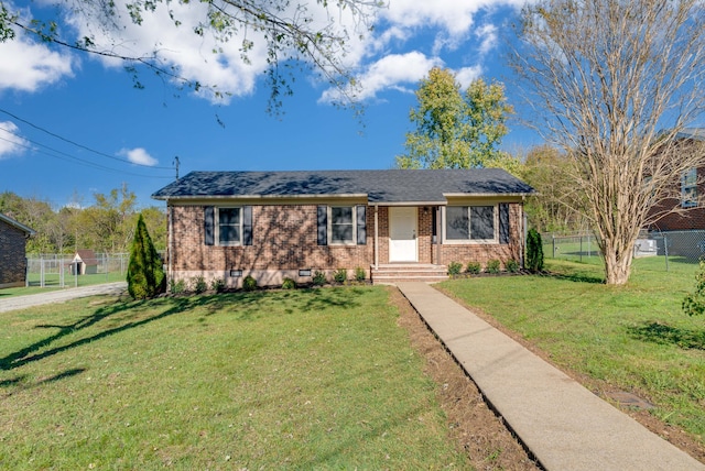 ranch-style house featuring a front yard