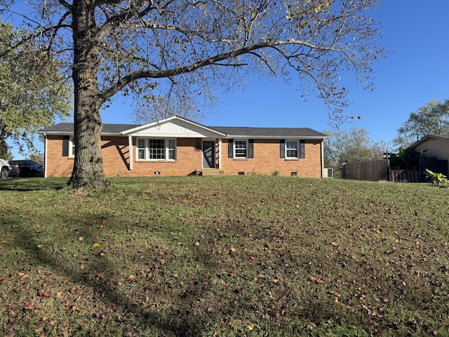 ranch-style home with a front lawn