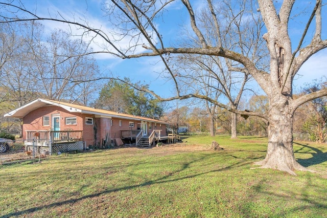 view of yard with a wooden deck