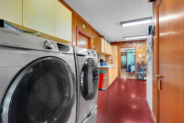 laundry area with washer and clothes dryer and cabinet space