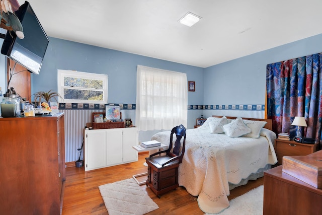 bedroom featuring wood finished floors