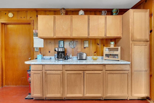 kitchen with light stone counters and light brown cabinets