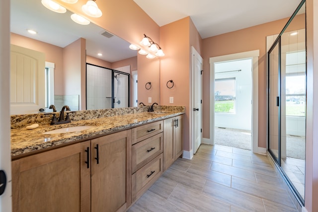 bathroom with vanity and walk in shower