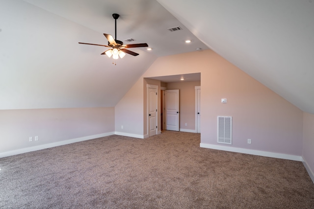 additional living space featuring ceiling fan, lofted ceiling, and carpet floors