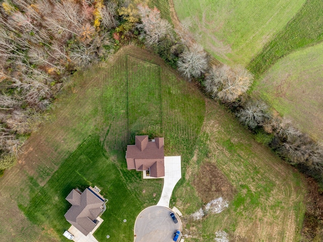 birds eye view of property with a rural view