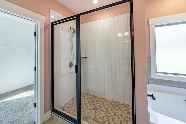 bathroom featuring plus walk in shower