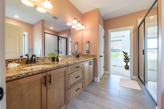 bathroom featuring vanity and walk in shower