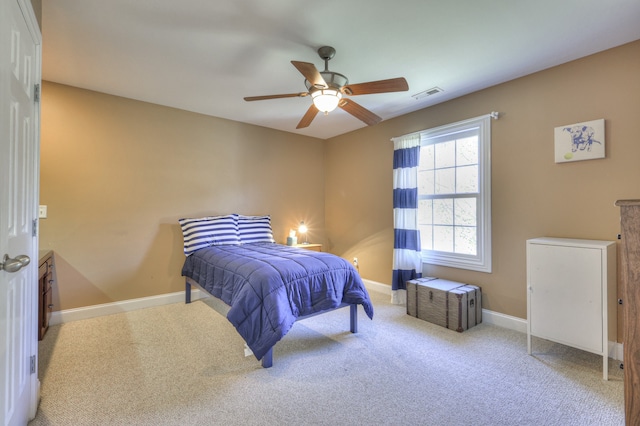 carpeted bedroom with ceiling fan