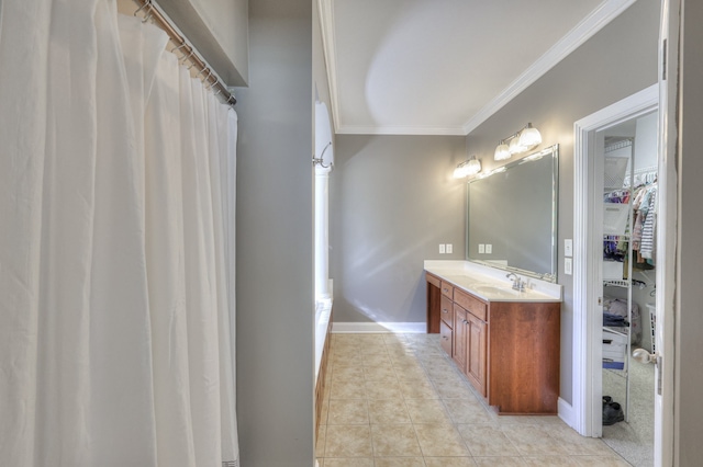 bathroom with tile patterned floors, vanity, and ornamental molding