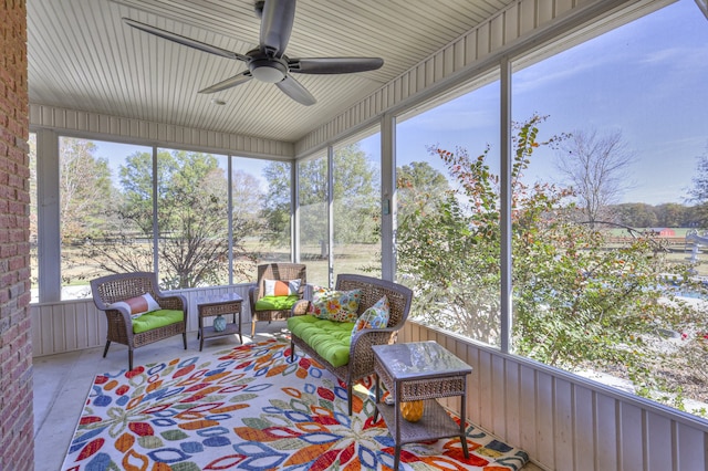 sunroom featuring ceiling fan