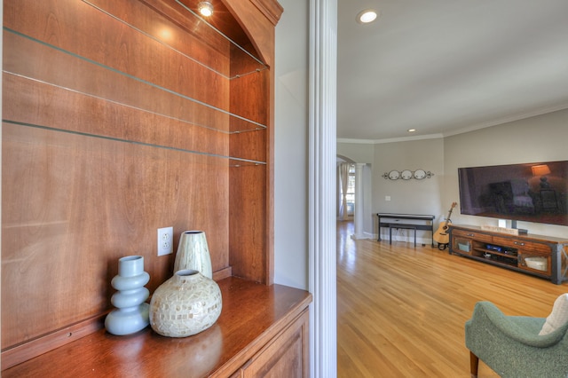 interior space featuring crown molding and hardwood / wood-style flooring