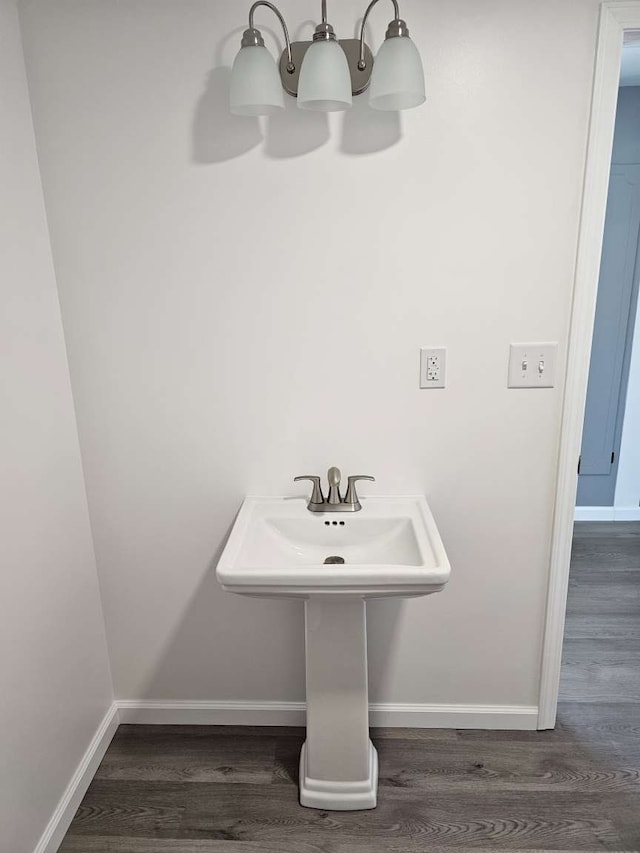 bathroom with wood-type flooring