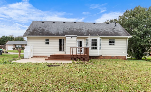 rear view of property with a lawn, a patio area, and a deck