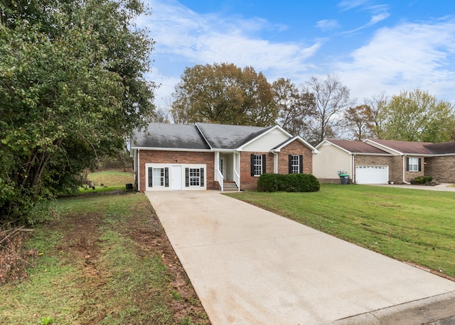 single story home with a garage and a front lawn