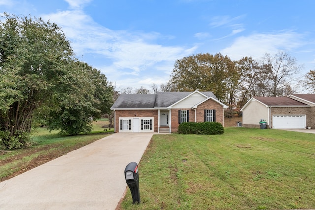 view of front facade with a front yard and a garage