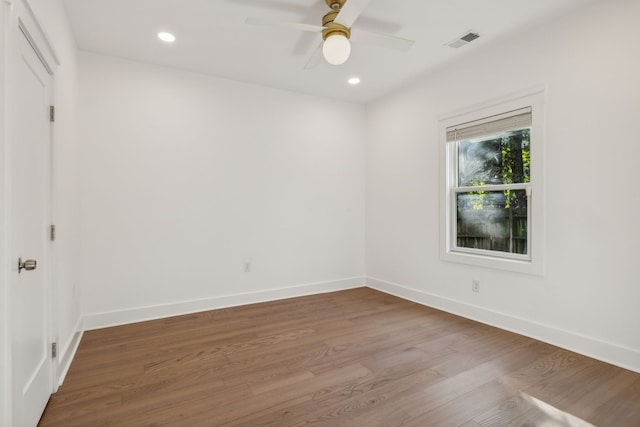 unfurnished room featuring ceiling fan and hardwood / wood-style flooring