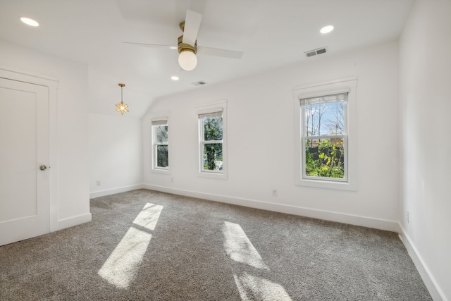 unfurnished room with carpet flooring and ceiling fan