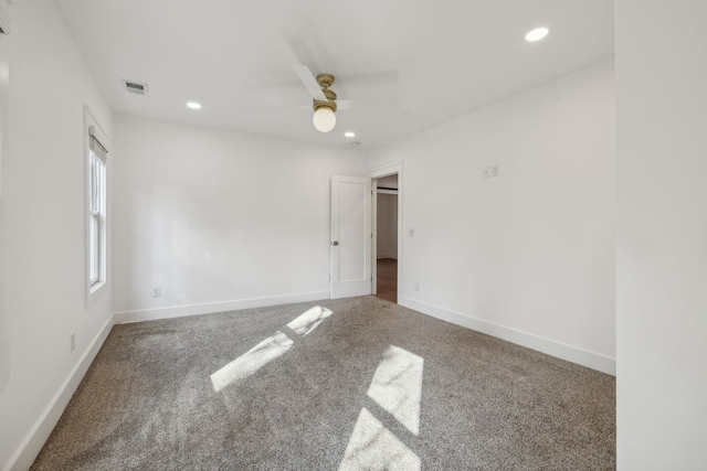 spare room with carpet flooring and ceiling fan