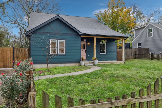 bungalow-style home with a front yard