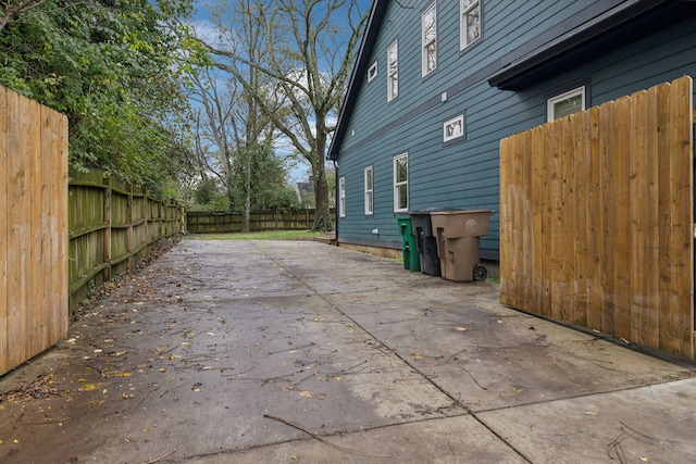 view of side of home with a patio area