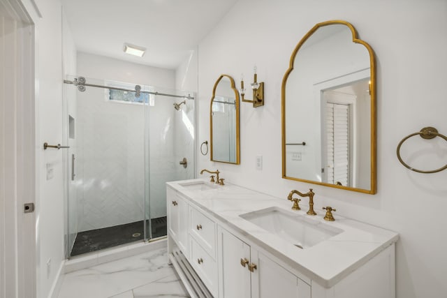 bathroom featuring a shower with door and vanity