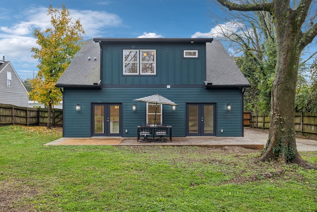 back of house with a patio area, a yard, and french doors