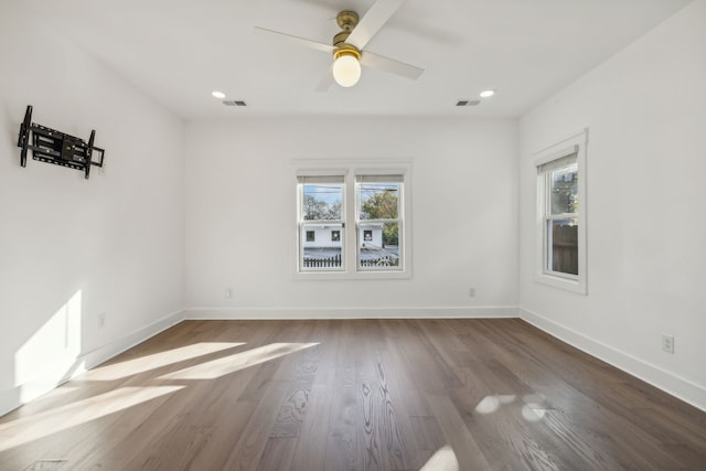 empty room featuring hardwood / wood-style flooring and ceiling fan