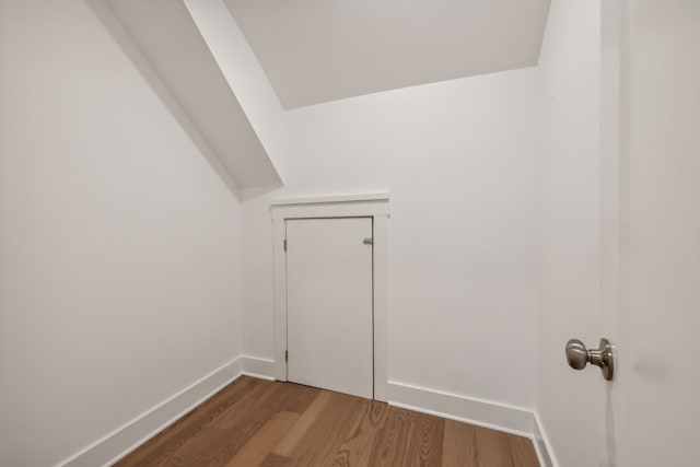 bonus room with dark hardwood / wood-style flooring