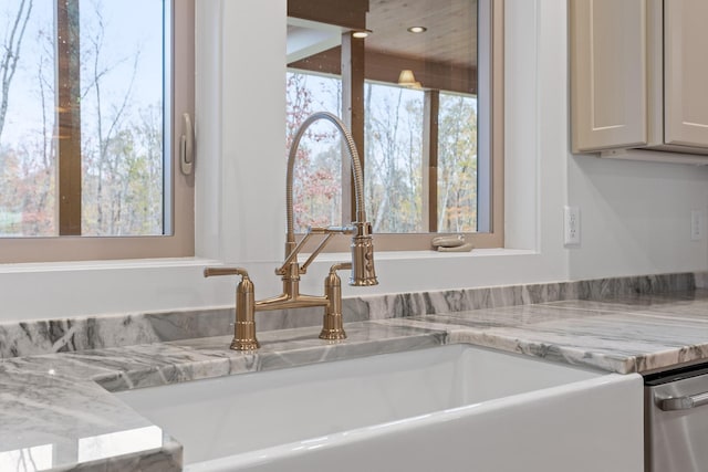 detailed view of a sink and stainless steel dishwasher