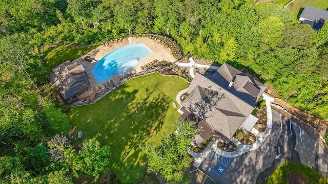 aerial view of property and surrounding area featuring a pool
