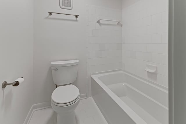 bathroom with shower / bath combination, tile patterned floors, and toilet