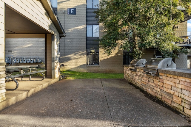 view of patio with area for grilling and grilling area