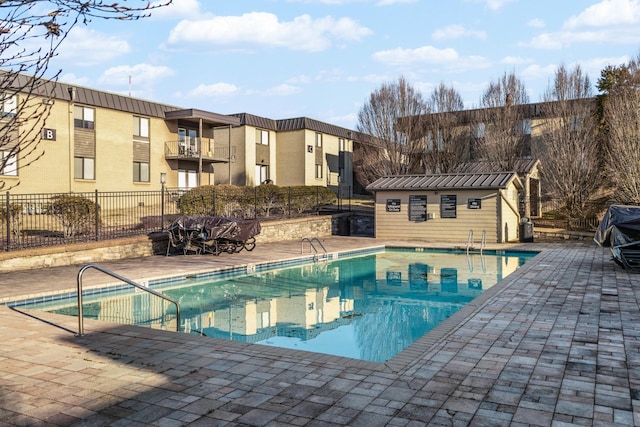 view of swimming pool with a patio area