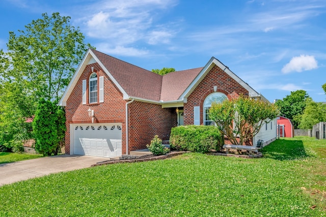 view of front property with a garage and a front lawn