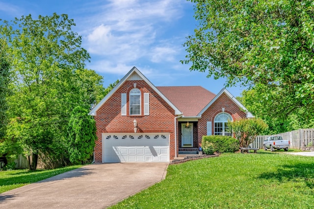 front facade with a front yard and a garage