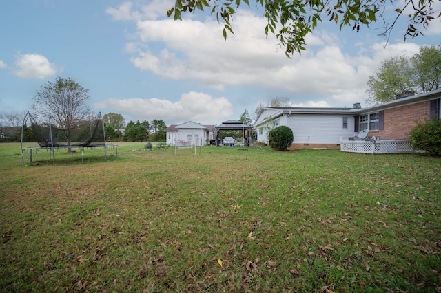 view of yard with a gazebo and a trampoline