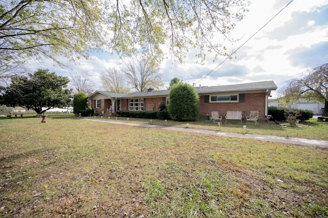 ranch-style home with a front yard