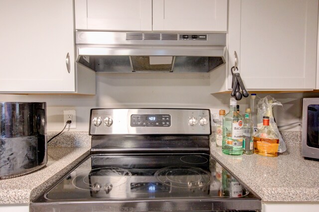 kitchen featuring white cabinetry and appliances with stainless steel finishes