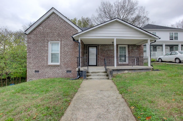 view of front facade with a front yard and a porch