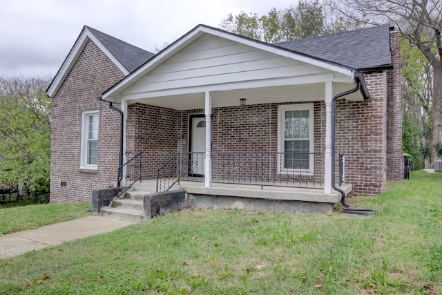 view of front of house with a front lawn and a porch