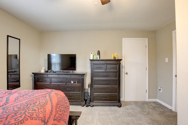 bedroom with ceiling fan and light carpet