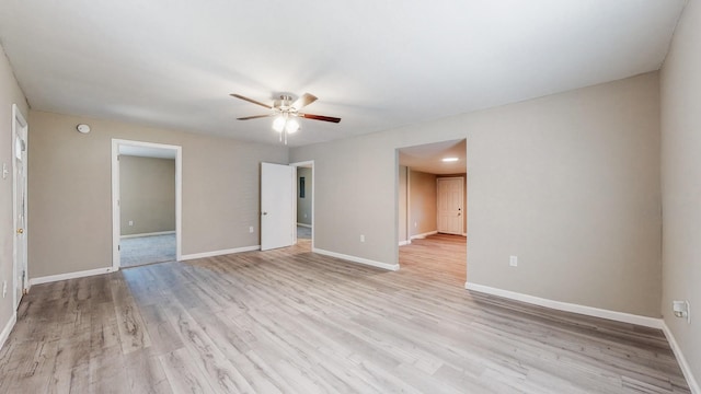 empty room featuring light wood-type flooring and ceiling fan