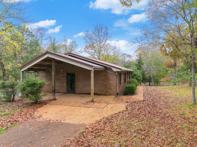 view of home's exterior featuring a carport